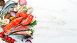 Seafood on a white background. Lobster, fish, shellfish. Top view. Free copy space.