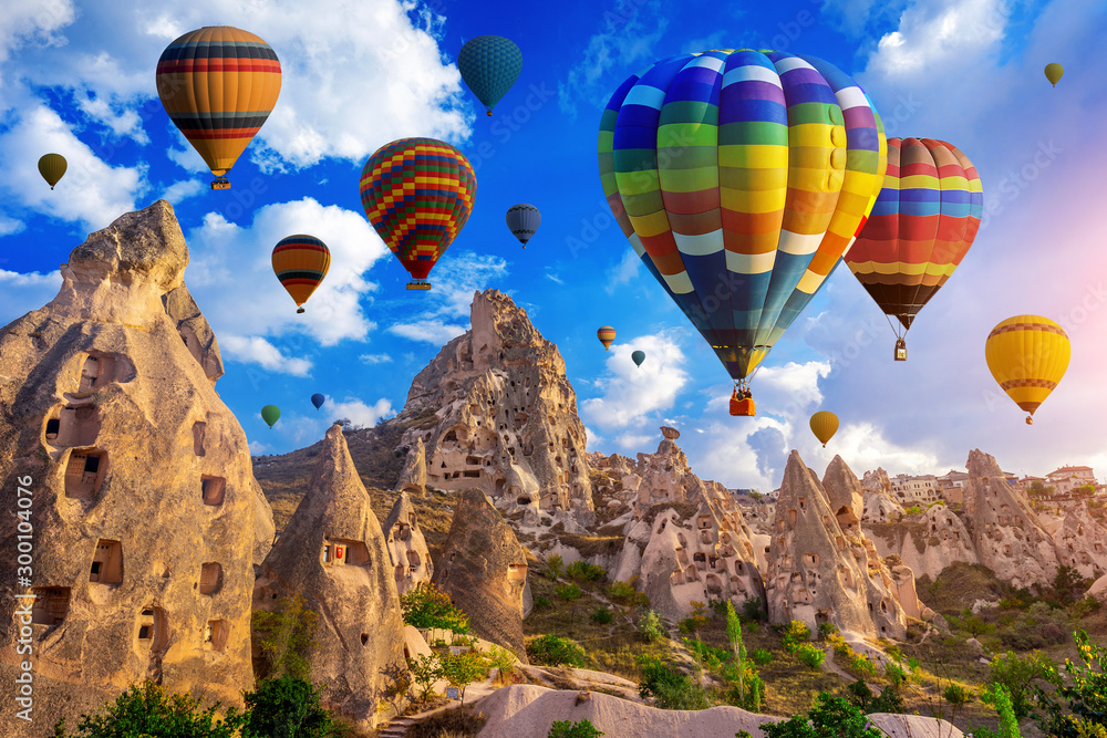 Colorful hot air balloon flying over Cappadocia, Turkey. - obrazy, fototapety, plakaty 