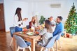 © Krakenimages.com - Beautiful family meeting smiling happy and confident. Speaking speech eating roasted turkey celebrating Christmas at home