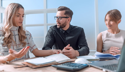 young business woman explaining her ideas at a business meeting.