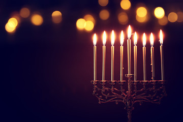 Religion image of jewish holiday Hanukkah background with menorah (traditional candelabra) and candles