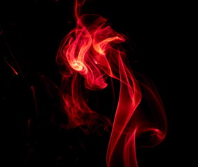 Red smoke on black background