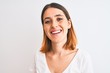 © Krakenimages.com - Beautiful redhead woman wearing casual white t-shirt over isolated background with a happy face standing and smiling with a confident smile showing teeth