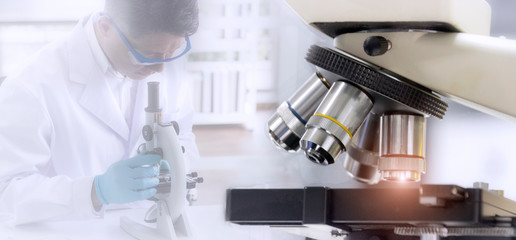 Wall Mural - laboratory concept; close up picture of microscope with blurred background of researcher use microsc
