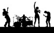 © Christos Georghiou - A musical group or rock band playing a concert in silhouette