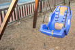 Safety seat for children and people with disabilities on a swing in a playground