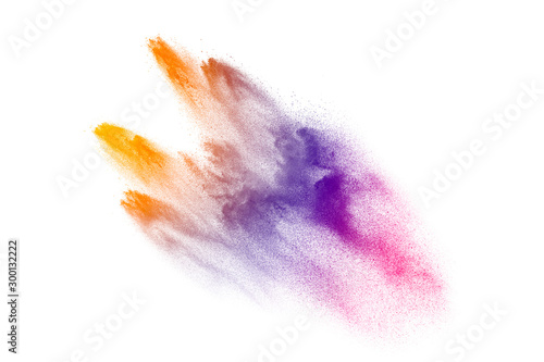 Multicolored powder explosion on white background.Launched colorful particles...