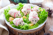 Celebratory Christmas crab salad in the form of mice on a dish with pieces of cheese, horizontal
