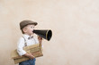 © Sunny studio - Child shouting through vintage megaphone