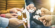 © REDPIXEL - A group of business people assembling jigsaw puzzle.
