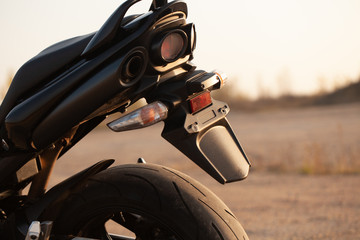 Wall Mural - One black motorcycle in the desert.