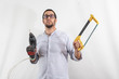 Man with drill. Young man with work tools. White background portrait.