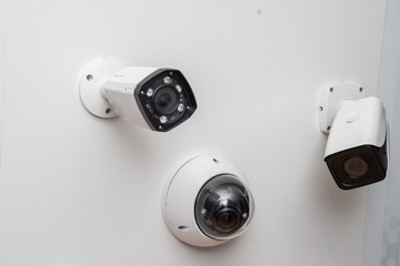 Security cameras. Surveillance cameras. White cameras