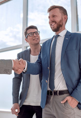 Wall Mural - business people greet each other in the office lobby