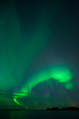 Wall Mural - stars and aurora borealis above lake