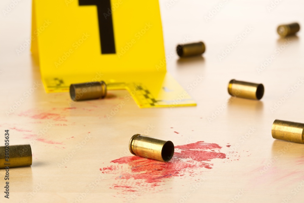 Crime scene investigation CSI evidence marker with empty, fired 9mm ...