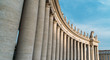 Colossal Tuscan colonnades of St. Peter, frame entrance to basilica, Vatican city, Rome, Italy.