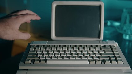 pointing and demonstrating something on a retro computer screen