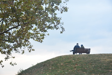 Two on a park bench