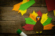 © anaumenko - Thanksgiving paper craft - thanksful turkey on wood background, top view