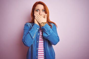 Sticker - Beautiful redhead woman wearing denim shirt and striped t-shirt over isolated pink background shocked covering mouth with hands for mistake. Secret concept.