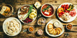 Selection of traditional ukrainian food - borsch, perogies, potato cakes, pickled vegetables, top view