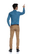 © Viorel Sima - back view of smart casual man in blue shirt pointing finger