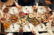 © Seventyfour - Above view at group of people sitting at dining table on Christmas and joining hands in prayer, copy space