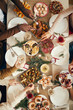 © Seventyfour - Above view background of people dining at festive Christmas table with delicious homemade food, copy space