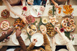 © Seventyfour - Top view background of people dining at festive Christmas table with delicious homemade food, copy space