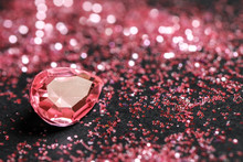 Beautiful Gemstone And Glitter On Dark Background, Closeup. Space For Text