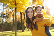 © New Africa - Happy woman with little daughter in sunny park. Autumn walk