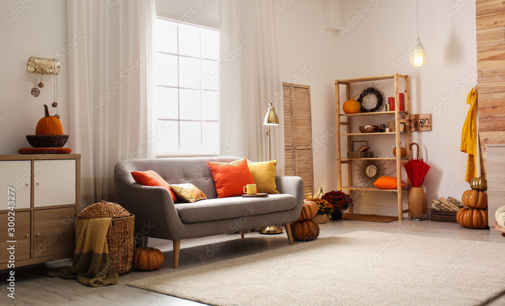 Cozy living room interior inspired by autumn colors - obrazy, fototapety, plakaty 