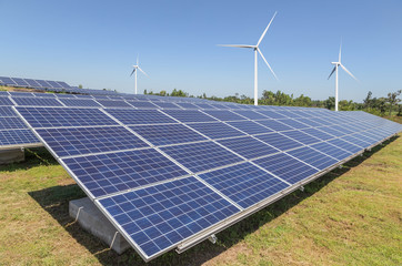 Poster - Solar panels and wind turbines generating electricity is solar energy and wind energy in hybrid power plant systems station use renewable energy to generate electricity with blue sky 