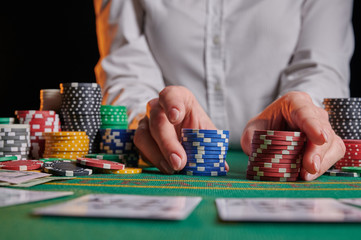 croupier raises bets with chips. casino, playing in a night club, gaming business. Winning and success, big money