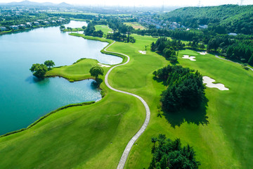 Wall Mural - Aerial view of golf course and water