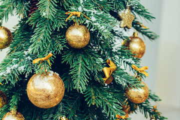Wall Mural - Green fir tree with golden balls. Christmas wallpaper.