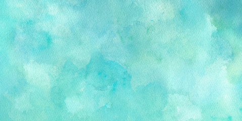 Green blue watercolor background texture in light pastel colors in pretty summer or spring green