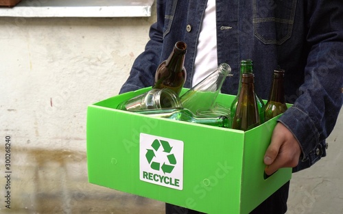 Glass bottles and jars outdoor recycle storage container. Reduce, Reuse, Recycle. Waste sorting bin. Recycling at home. Zero waste lifestyle. Household waste disposal