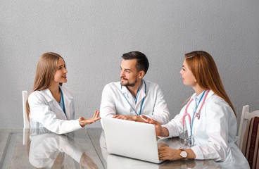 Canvas Print - Team of doctors during meeting in clinic