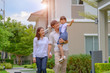 © ID_Anuphon - family walking on the model new house looking for living life future, new family meet new house