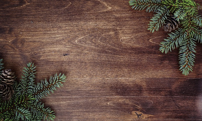 new year's background. spruce branches on a wooden table. ornaments for the new year tree. christmas