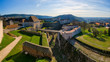 Top view of a part of the old citadel in the city of Besancon. France. The entrance gates, walls, towers and a deep moat are visible. A part of the city is visible in the distance. Scenery.