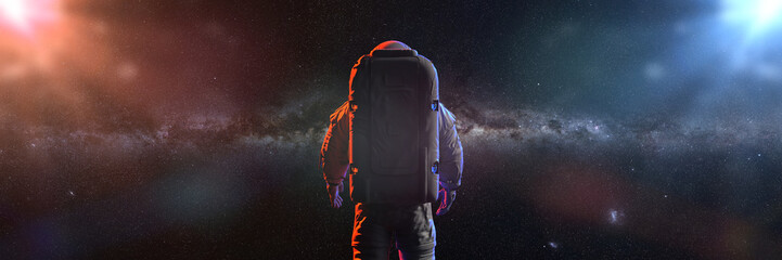 standing astronaut in front of the beautiful Milky Way galaxy 