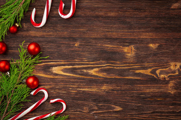 Christmas background with candy cane on decorated wooden desk