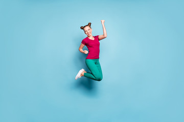 Poster - Full length body size turned photo of cheerful positive cute charming pretty girlfriend wearing pants trousers green white sneakers overjoyed about victory isolated pastel color blue background