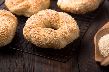 Seeds bagel stack bakery background. Homemade tasty bagel bun, white & black sesame, flax seeds, chia. Healthy breakfast food bakery background. German turkish bread brunch bagel - bakery background