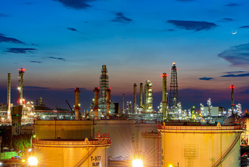 Oil and gas refinery plant area at sunset