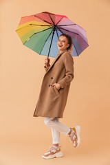 Poster - Photo of laughing attractive woman holding umbrella while walking