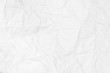 © Alex - Textured background of crumpled white paper crumpled and spread.